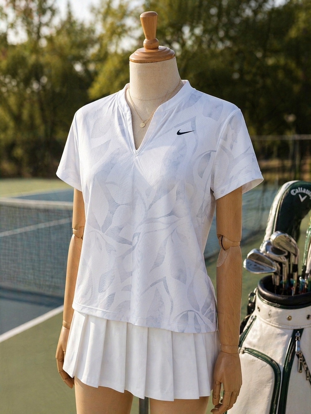 Nike White Short-Sleeve V-Neck Tennis Top with Tonal Leaf Pattern